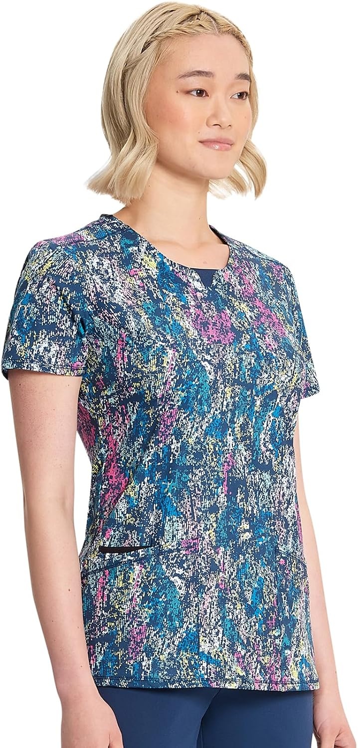 image:imageCherokee Infinity Printed Scrub Tops for Women Round Neck 3 Pockets Comfortable Fit Stretch Fabric Coverstitch Detailing Rib Knit Neckline Inset Princess Seams Side Vents Easy CareColorful Distress
