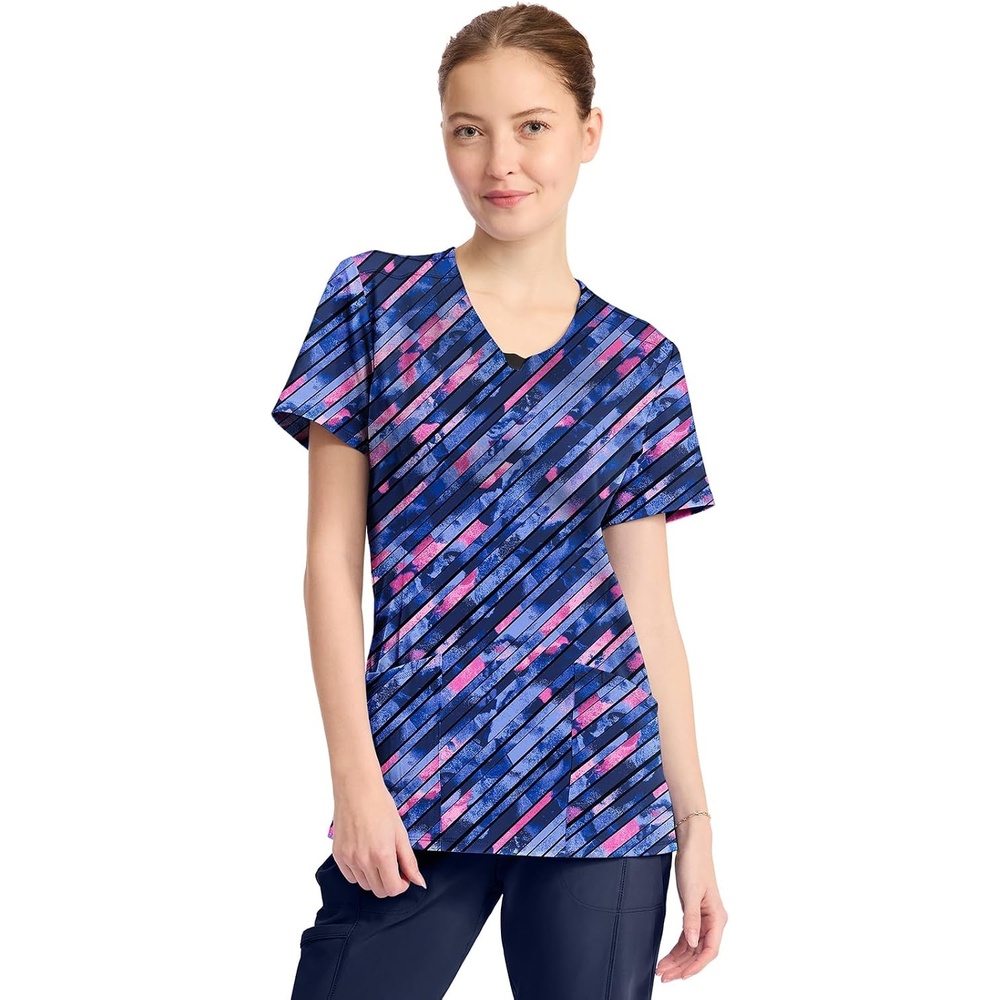 image:imageCherokee Infinity Printed Scrub Tops for Women Round Neck 3 Pockets Comfortable Fit Stretch Fabric Coverstitch Detailing Rib Knit Neckline Inset Princess Seams Side Vents Easy CareStaggered Marble