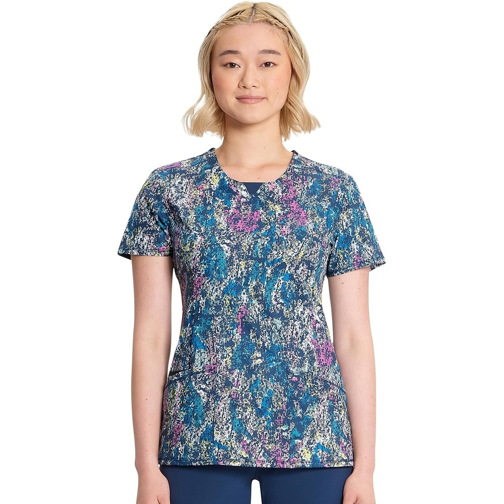image:imageCherokee Infinity Printed Scrub Tops for Women Round Neck 3 Pockets Comfortable Fit Stretch Fabric Coverstitch Detailing Rib Knit Neckline Inset Princess Seams Side Vents Easy CareColorful Distress